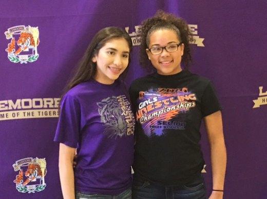 Lemoore High School's Angelita Sanchez (left) and Gracie Clark will continue their wrestling careers in college. The two signed with colleges May 18.